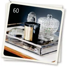  ??  ?? Styling tip: Class up a vignette with artful glass accents and then add one jet-black piece for impact. 60