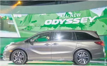  ??  ?? A new Honda Odyssey minivan is unveiled at the North American Internatio­nal Auto Show in Detroit in January 2017. Honda recorded a 6.7% decline in July-September profit.