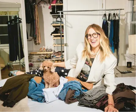  ?? MAGGIE SHANNON/THE NEW YORK TIMES PHOTOS ?? Stylist Chellie Carlson, seen Jan. 18 at her Los Angeles home, helps her clients edit their wardrobes down.