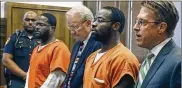  ?? AKRON BEACON JOURNAL ?? Brothers Donyea (left) and Orlando Tyus listen to Judge Alison McCarty as she sentences them to life in prison without parole on Monday in Akron.