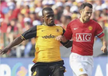  ??  ?? Tinashe Nengomasha tussling for possession with Manchester United legend Ryan Giggs