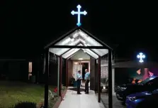  ?? ?? Security officers stand guard outside the Christ the Good Shepherd Church