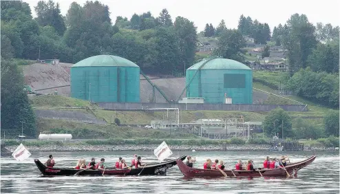  ?? JONATHAN HAYWARD / THE CANADIAN PRESS FILES ?? First Nations dugouts and Kinder Morgan oil tanks. The Trudeau government is in a vice: force the Trans Mountain pipeline through and risk a political firestorm in B.C., or let it die and risk worse in Alberta, Andrew Coyne writes.