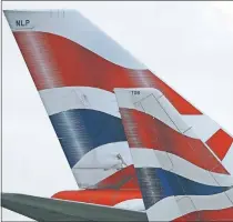  ?? [AP PHOTO] ?? British Airways planes are parked at Heathrow Airport in London.