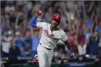 ?? MATT ROURKE — THE ASSOCIATED PRESS ?? Philadelph­ia Phillies’ Cristian Pache reacts after hitting a RBI single off Colorado Rockies pitcher Jacob Bird during the 10th inning of a baseball game, Monday, April 15, 2024, in Philadelph­ia.