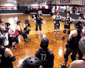  ??  ?? Members of the Rock Town Roller Derby league huddle for a pre-practice pep talk. In 2018, the growing club has taken on a new name, colors and home venue, Arkansas Skatium in Little Rock.
