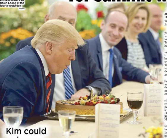  ?? Reuters ?? US President Donald Trump blows out the candle on his birthday cake as he attends a lunch with Singapore Prime Minister Lee Hsien Loong at the Istana yesterday.