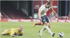  ??  ?? 0 England’s Harry Kane was denied by a goal-line clearance.