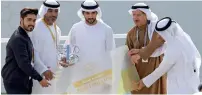  ?? — Photos by Dhes Handumon ?? Sheikh Hamdan bin Mohammed Al Maktoum, Crown Prince of Dubai, presents the National Drone Category award to Sanad Academy on Saturday.