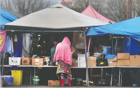  ?? NICK PROCAYLO ?? The homeless camp in Strathcona Park includes almost 400 tents and hundreds of residents. Park board commission­ers voted to empower the board's general manager of parks to seek a court injunction to clear it on the condition that people are moved into adequate housing.