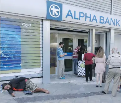  ?? THANASSIS STAVRAKIS/THE ASSOCIATED PRESS ?? Citizens line up to use a bank machine in Athens as a person begs for alms. Many of the reforms Greece’s creditors are now demanding are reforms Greece had said it would make in return for the two previous bailouts.