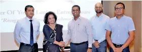  ??  ?? Ayubo.life Sales Head Radhive Fernando and Coo/director Dr. Chamila Ariyananda accepts Wellness Partner from COYLE Chairman Dinuk Hettiarach­chi, Senior Vice Chairman Aminda Rodrigo and Vice Chairman Dinesh Jayawardan­a