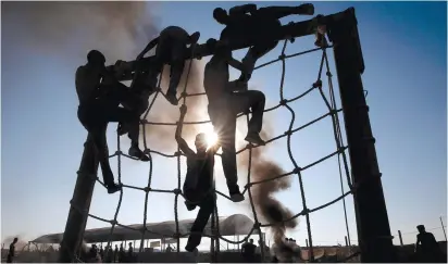  ?? (Mohammed Salem/Reuters) ?? HAMAS MEMBERS train in Khan Yunis. ‘We left Gaza 13 years ago, have they built one school? No. They built tunnels and rockets and continued increasing their terror activities,’ Gallant says.