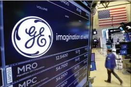 ?? RICHARD DREW / ASSOCIATED PRESS ?? General Electric, whose logo appears here above a trading post at the New York Stock Exchange this past July, will “need to make some major changes,” the Boston-based conglomera­te’s new CEO, John Flannery, said Friday.