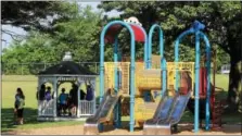  ?? DIGITAL FIRST MEDIA FILE PHOTO ?? People stand underneath a gazebo next to a playground at Douglass Park in Douglass Township.