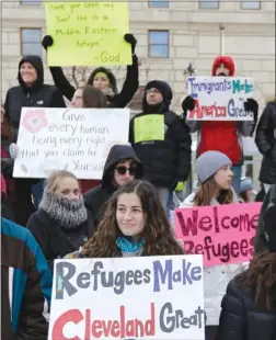  ?? The Associated Press ?? People protest at a demonstrat­ion Friday in Cleveland. The demonstrat­ion was organized in protest of President Donald Trump’s immigratio­n order.