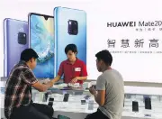  ?? GREG BAKER / AFP / GETTY IMAGES ?? Huawei has quietly establishe­d itself as a provider of technology essential to Canada’s telecom infrastruc­ture.