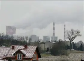  ?? CZAREK SOKOLOWSKI — THE ASSOCIATED PRESS ?? Smoke billows from chimney stacks of the heating and power plant in Bedzin, near Katowice, Poland. The COP 24 UN Climate Change Conference is taking place in Katowice. Negotiator­s from around the world are meeting for talks on curbing climate change.