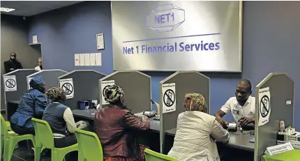  ?? / THULI DLAMINI ?? Social grants recipients in KwaZulu-Natal get their payments at Net 1 Financial Services, one of the informatio­n technology partners to Grindrod Bank: