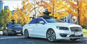  ??  ?? Ford and Baidu announce the beginning of a joint autonomous vehicle test project in Beijing on Oct 31.