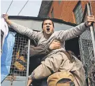 ?? EPA ?? A Shiite Muslim from the disputed Kashmir region shouts from an Indian police vehicle after he was detained during a protest in Srinagar in 2015.