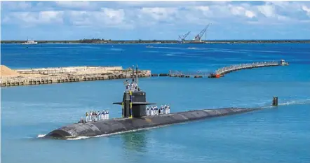  ?? — AP ?? French snub: Australia has made a deal with the US to purchase nuclear-powered submarines based on Us-developed technology.