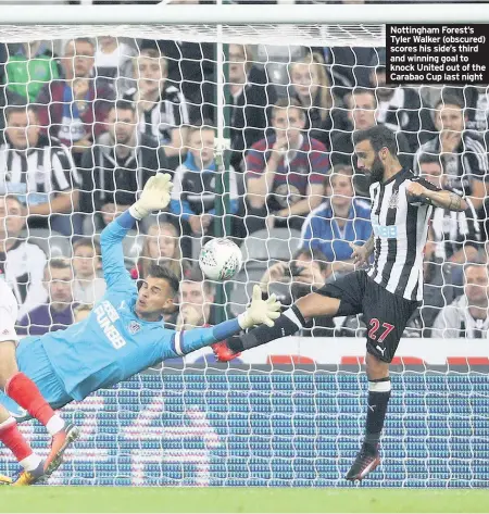  ??  ?? Nottingham Forest’s Tyler Walker (obscured) scores his side’s third and winning goal to knock United out of the Carabao Cup last night