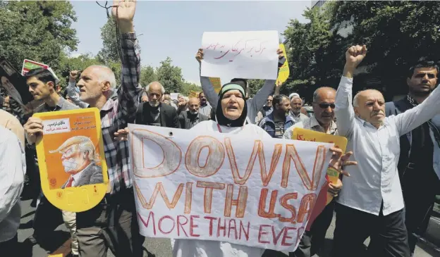  ?? PICTURE/AFG/GETTY IMAGES ?? Iranians stage an anti-us protest after Friday prayers in Teheran following Donald Trump’s decision to end the Iran nuclear deal