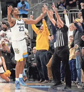  ?? ?? David Joplin gestures toward Golden Eagles fans after hitting a big three late in the game against Xavier on Wednesday.