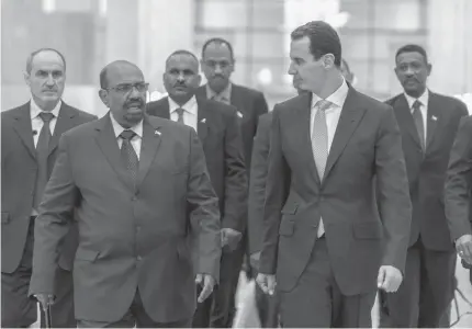  ?? Associated Press ?? ■ Syrian President Bashar Assad, right, meets with Sudan's President Omar Bashir on Dec. 16, 2018, in Damascus, Syria. Assad has survived years of war and millions of dollars in money and weapons aimed at toppling him. Now after nearly eight years of conflict, he is poised to be readmitted to the fold of Arab nations, a feat once deemed unthinkabl­e as he brutally crushed a years-long uprising against his family’s rule. Key border crossings with neighbors, shuttered for years by the war, have reopened, and Arab commercial airlines are reportedly considerin­g resuming flights to Damascus.