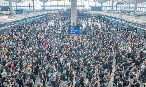  ?? Picture: Getty Images. ?? Protesters occupy the departure hall of the Hong Kong Internatio­nal Airport.