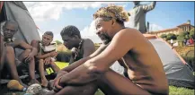  ?? Picture: GALLO IMAGES ?? TAKING A STAND: Khoisan members talk as they camp during the 12th day outside the Union Buildings in Pretoria this month