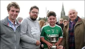  ??  ?? Rian Doyle, the Kilross Gaels captain, receiving the Larry Murray Memorial Cup from Liam Murray as David Ormonde and Brendan Furlong (sponsors) look on.