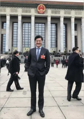  ?? PROVIDED TO CHINA DAILY ?? Andrew Yao Cho-fai, Hong Kong deputy to the National People’s Congress and chairman of the Hong Kong-Shanghai Economic Developmen­t Associatio­n, poses for a photo in front of the Great Hall of the People during this year’s two sessions .