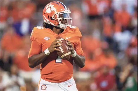  ?? Jacob Kupferman / Getty Images ?? Clemson QB Taisun Phommachan­h has kept in touch while offering support and advice to his younger brother Tyler, UConn’s starting QB.