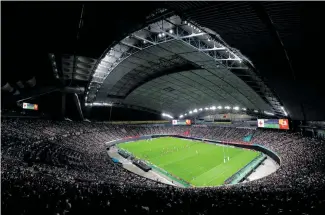  ?? Photo / Getty Images ?? The Sapporo Dome’s baseball field is removed and a retractabl­e pitch slid in from outside.