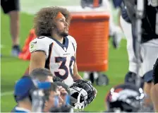  ?? Andy Cross, The Denver Post ?? Broncos running back Phillip Lindsay ( 30) ran the ball just four times and was targeted once in the passing game in Sunday’s loss.