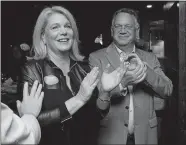  ?? DANA JENSEN/THE DAY ?? Heather Somers is applauded by her husband, Mark Somers, right, and she applauds all her supporters that gathered at The Spot in Groton after the polls closed.