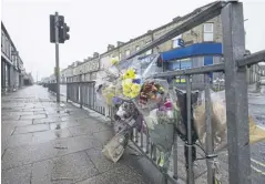  ?? ?? Flowers left for the much-loved woman who died.