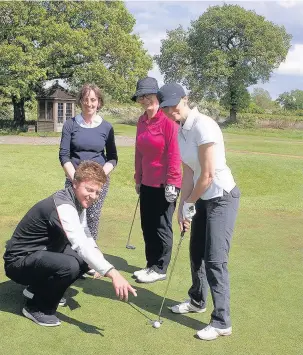  ??  ?? The group in action on the course