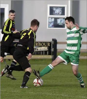  ??  ?? David O’Neill of Arklow United and Brian Thompson of Arklow Celtic battle for possession during their Wicklow Cup first round game.