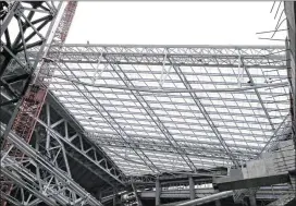  ?? JIM MONE / AP ?? Constructi­on continues on the newVikings stadium in Minneapoli­s with the see-through, lightweigh­t ETFE roof panels that will let the light streamin during games.