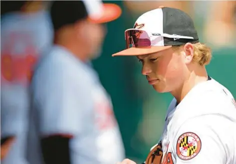  ?? GETTY MIKE EHRMANN/ ?? Orioles prospect Jackson Holliday looks on during a spring training game against the Pirates at Ed Smith Stadium on Feb. 29 in Sarasota, Florida.