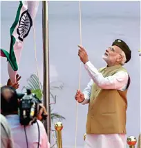  ?? PTI ?? PM Modi hoists tricolour at Red Fort on Azad Hind Govt’s 75th anniversar­y