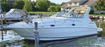  ??  ?? LIKE NEW? This Cruisers Yachts 2870, shown on its mooring at Lakeside Marina in Oshkosh, Wisconsin, is now ready for more seasons of cruising the Lake Winnebago region. This boat was an excellent repower candidate because it’s in great condition, was a quality boat when it was new, and its owners have some real passion for the vessel.