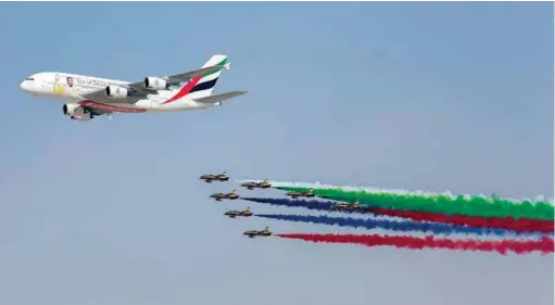  ??  ?? The 100th A380 delivered by Airbus to Dubai-based Emirates leads a formation of the United Arab Emiratesí Al Fursan (The Knights) aerobatic display team as an opening aerial presentati­on at the Dubai Airshow 2017