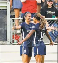  ?? Karl B DeBlaker / Associated Press ?? North Carolina Courage’s Jessica McDonald (14) celebrates her goal with Abby Erceg during the first half of the NWSL championsh­ip game against the Red Stars.
