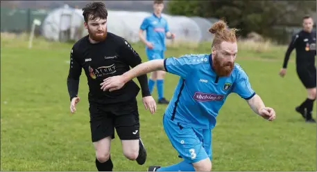  ??  ?? Gary Armstrong of Carbury in action with Moore Utd during the FAI New Balane Junior Cup 3rd Round in Sean Fallon Park. Pic: Donal Hackett.