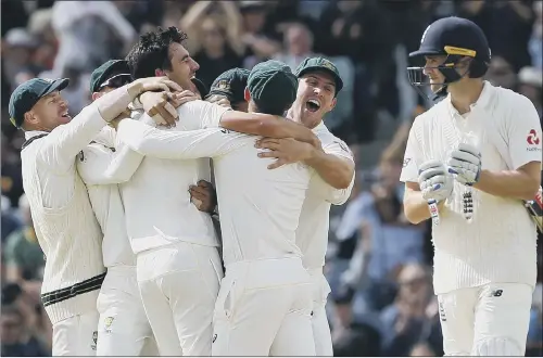 ?? PICTURE: JASON O’BRIEN/PA ?? CONTRASTIN­G EMOTIONS: Australia’s players celebrate taking the wicket of England’s Chris Woakes, right, which sealed the third Test and secured the Ashes.