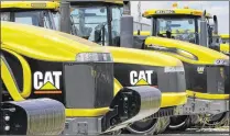  ?? SETH PERLMAN / ASSOCIATED PRESS 2012 ?? Caterpilla­r Inc., which has been making earth-moving equipment such as these tractors since 1909 in Peoria, Ill., will be moving 300 jobs to Chicago. The news comes as a blow to Peoria, which has been a company town for “Cat.”